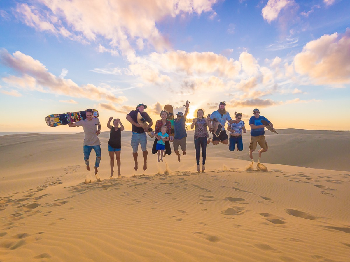 a group of people on a beach